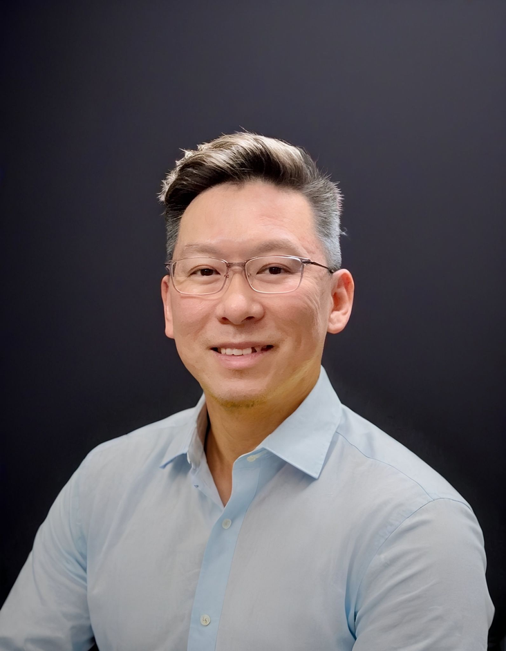 Melvin Ong in a formal business portrait